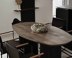 Oval Rellgo dining table in a living room.