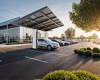 Solar panel under the white cars.